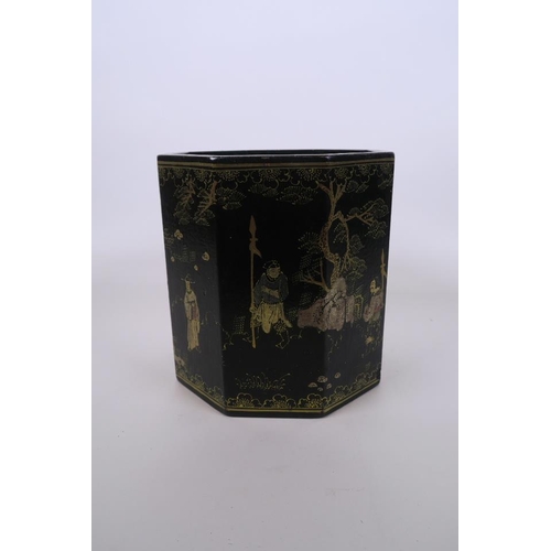 51 - A Chinese black lacquer hexagonal brush pot, with gilt enamel decoration of figures in landscape sce... 