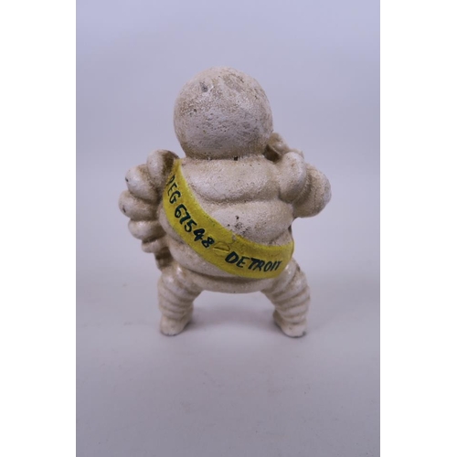 9 - A cast and painted metal novelty money box in the form of the Michelin Man, 5½