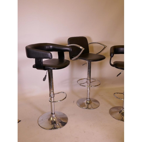 1162 - A pair of chrome and leatherette adjustable bar stools, on pedestal bases and another similar