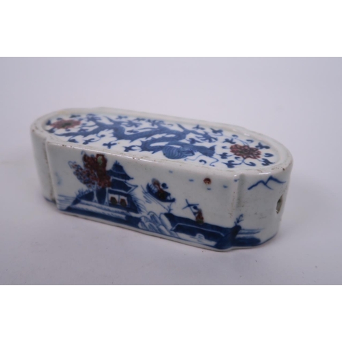 17 - A Chinese blue and white porcelain wrist rest, decorated with a dragon and landscape scenes highligh... 