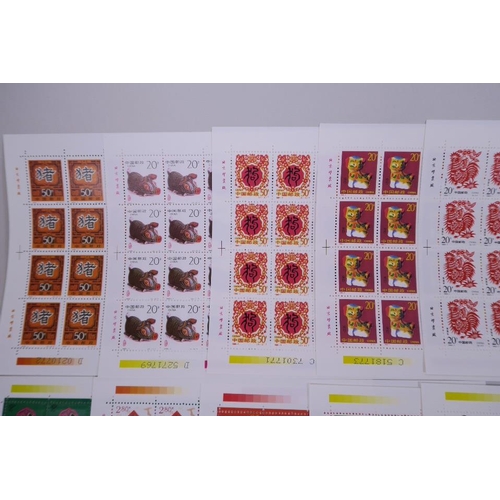 28 - A quantity of facsimile (replica) Chinese stamp sheets celebrating animals of the zodiac, 9