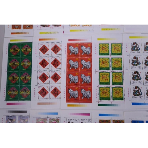 28 - A quantity of facsimile (replica) Chinese stamp sheets celebrating animals of the zodiac, 9