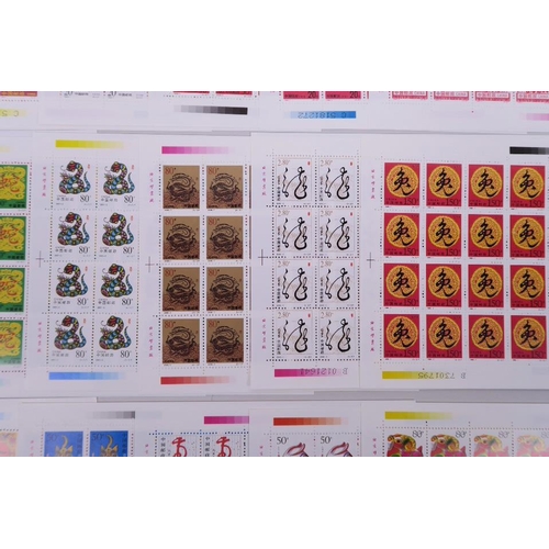 28 - A quantity of facsimile (replica) Chinese stamp sheets celebrating animals of the zodiac, 9