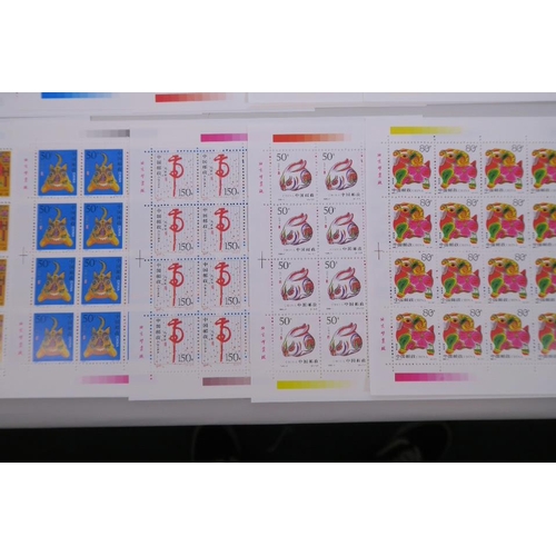 28 - A quantity of facsimile (replica) Chinese stamp sheets celebrating animals of the zodiac, 9