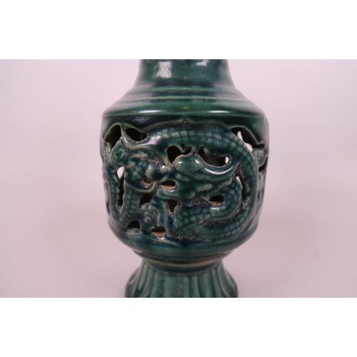 31 - A Chinese green crackle glazed porcelain vase of unusual form, with pierced sides decorated with dra... 