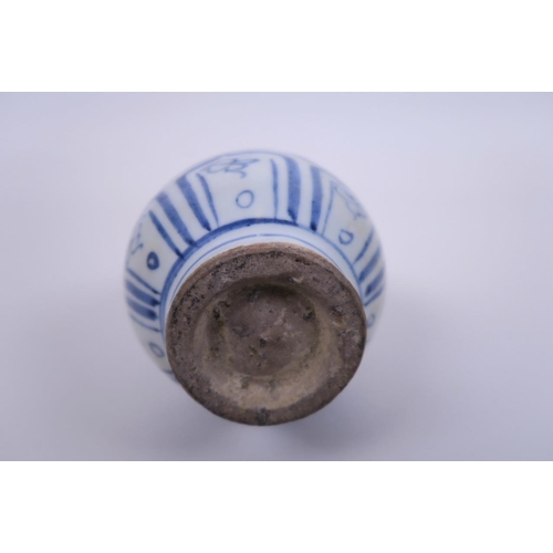 33 - A small Chinese Ming style blue and white pottery pear shaped vase, with scrolling floral decoration... 