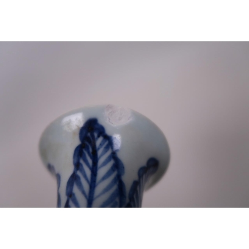 33 - A small Chinese Ming style blue and white pottery pear shaped vase, with scrolling floral decoration... 