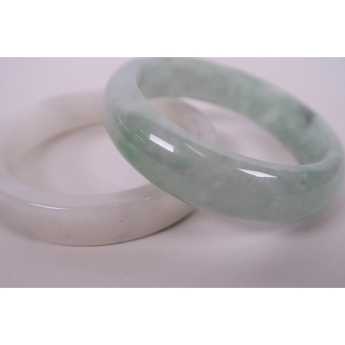 25 - A Chinese mottled green jade bangle together with another, 3