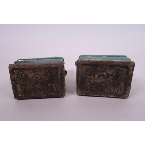 26 - A pair of Chinese green crackle glazed pottery seals surmounted by kylin, 4