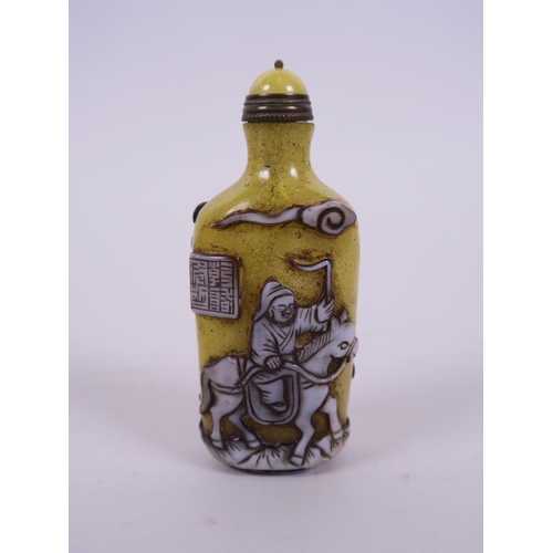 14 - A Peking glass snuff bottle, with decoration of travelling figures, 3½