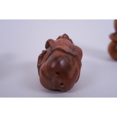 33 - A collection of three carved wood netsuke in the form of gourds, carp and toads, signed to base, lar... 