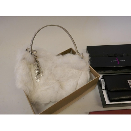 34 - A Piquadro Nikolai leather wallet, in original case, a Cole and Haan cream fur clutch bag, a Jasper ... 