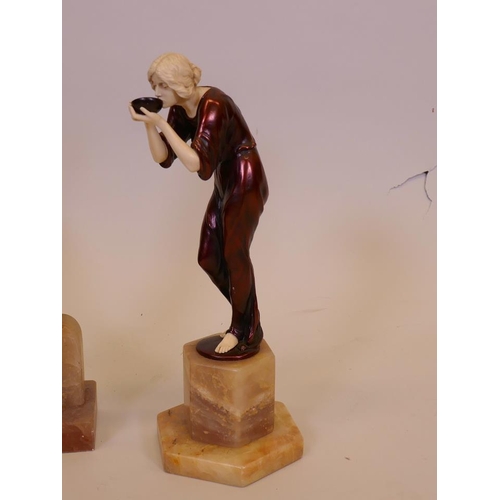 49 - A contemporary Art Deco figurine of Pierrot mounted on an alabaster base, 14