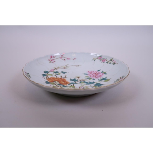 5 - A Chinese polychrome enamel porcelain dish with frilled rim, decorated with peonies and prunus bloss... 