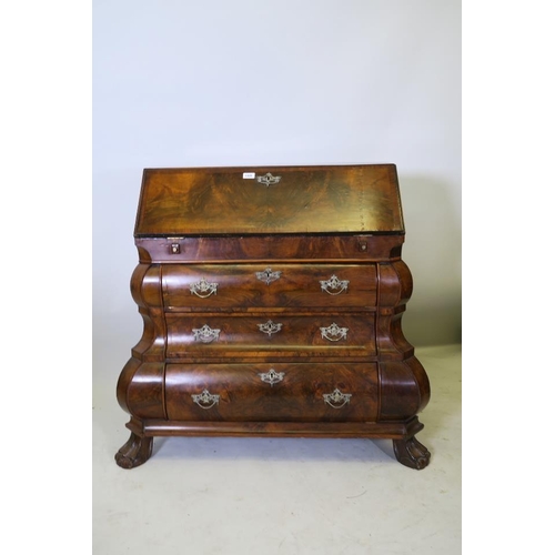 1201 - A C18th style Dutch bombe shaped bureau, the fall front with fitted interior, over three drawers, ra... 