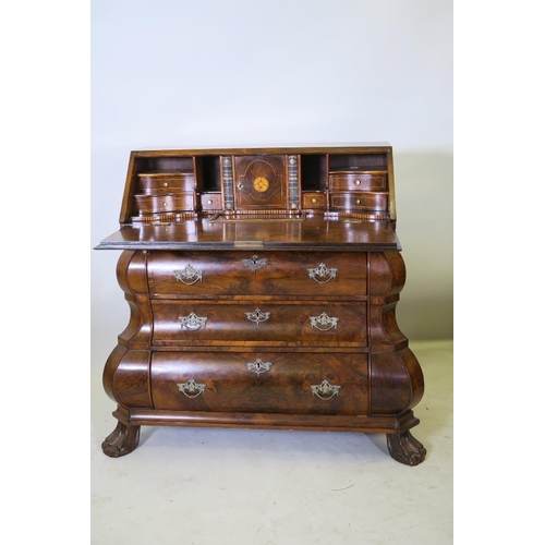 1201 - A C18th style Dutch bombe shaped bureau, the fall front with fitted interior, over three drawers, ra... 