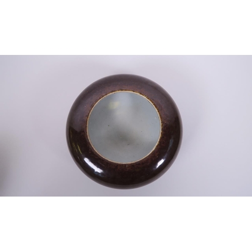 23 - A Chinese brown glazed porcelain footed trinket dish with a rolled rim, seal mark to base, 5