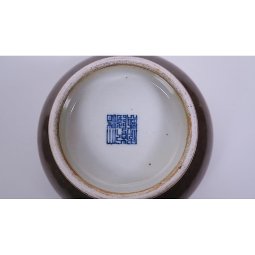 23 - A Chinese brown glazed porcelain footed trinket dish with a rolled rim, seal mark to base, 5