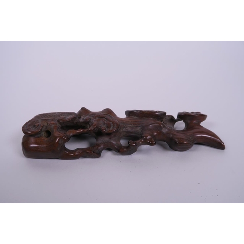 35 - A Chinese carved hardwood brush rest in the form of a root, 7½