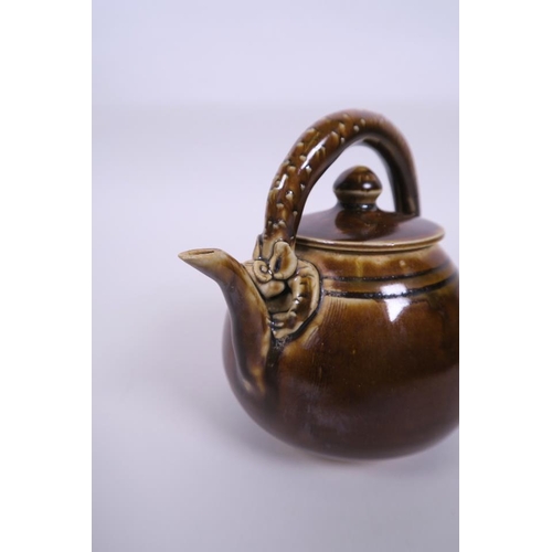 48 - A Chinese brown glazed pottery teapot with arching handle in the form of a dragon, 5