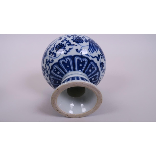 5 - A Chinese blue and white porcelain globular stem cup, decorated with a phoenix in flight, 6 characte... 