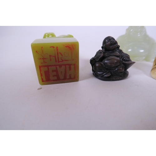 51 - A Chinese carved jade seal, the square base surmounted by a kylin 2½