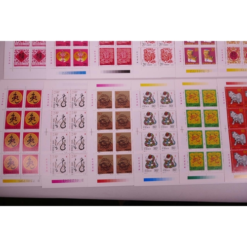 11 - A collection of 24 facsimile (replica) Chinese stamp sheets decorated with animals of the zodiac, 9½... 