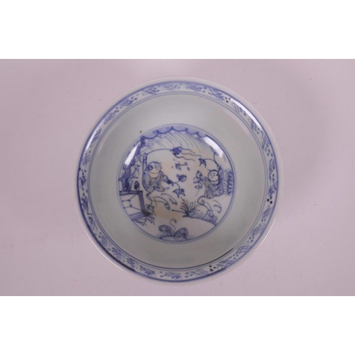 20 - A Chinese blue and white porcelain rice bowl decorated with figures flying kites, 5½