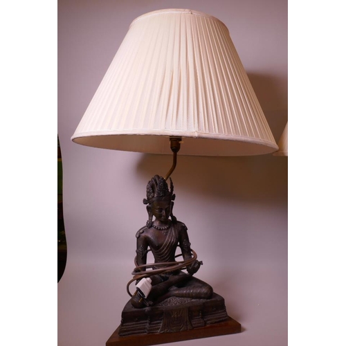 21 - A bronze table lamp, the base cast as Buddha seated in meditation (figurine 12