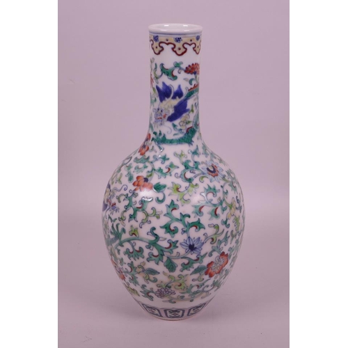 30 - A Chinese doucai porcelain bottle vase decorated with dragons amongst flowers, seal mark to base, 10... 