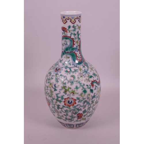 30 - A Chinese doucai porcelain bottle vase decorated with dragons amongst flowers, seal mark to base, 10... 