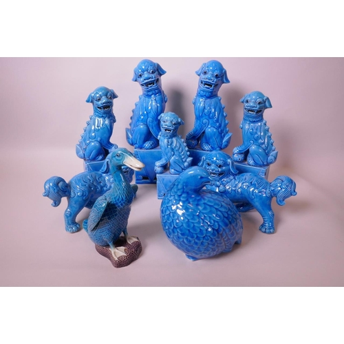 31 - Nine blue glazed Chinese porcelain figurines of animals and birds, seven kylins, a duck and a quail,... 