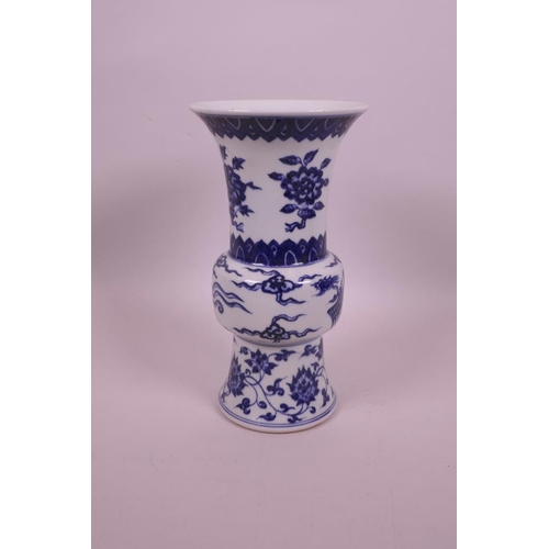 43 - A Chinese blue and white porcelain gu shaped vase with phoenix and flower decoration, 6 character ma... 