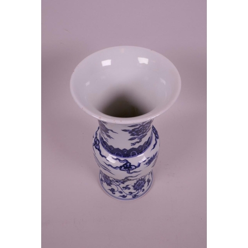 43 - A Chinese blue and white porcelain gu shaped vase with phoenix and flower decoration, 6 character ma... 