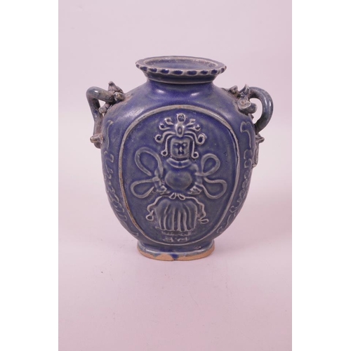 6 - A Chinese blue glazed pottery vase with two dragon handles and raised Quan Yin decoration, 6