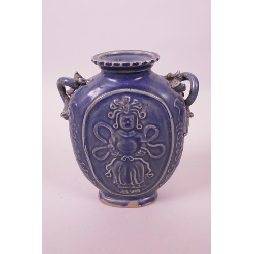 6 - A Chinese blue glazed pottery vase with two dragon handles and raised Quan Yin decoration, 6