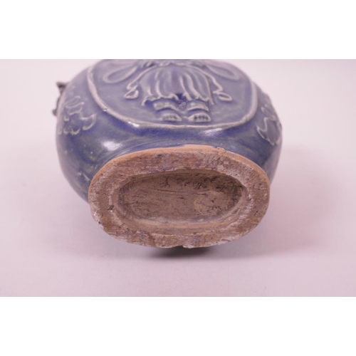 6 - A Chinese blue glazed pottery vase with two dragon handles and raised Quan Yin decoration, 6