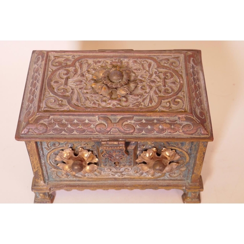 60 - A good quality C19th cast bronze trinket casket with chased and engraved decoration and applied copp... 