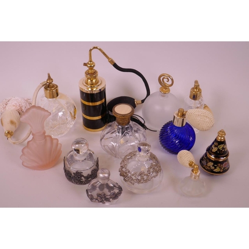 19 - Five perfume atomisers together with a collection of seven decorative perfume bottles (12)