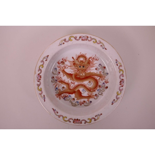 23 - A Chinese polychrome porcelain trinket dish with enamel decoration of a dragon chasing the flaming p... 