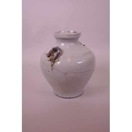 28 - A Chinese white crackle glazed globular pottery vase with applied dragon decoration, 7½