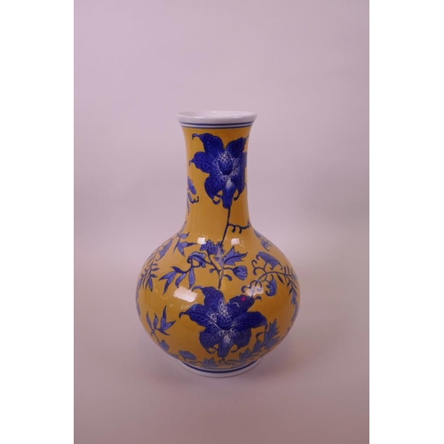 3 - A Chinese yellow ground porcelain vase with blue floral decoration, 11½