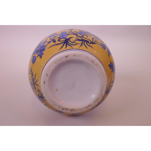 3 - A Chinese yellow ground porcelain vase with blue floral decoration, 11½