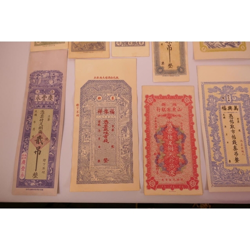 34 - An assorted collection of facsimile (replica) banknotes and cheques, largest 10