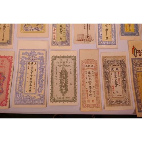 34 - An assorted collection of facsimile (replica) banknotes and cheques, largest 10