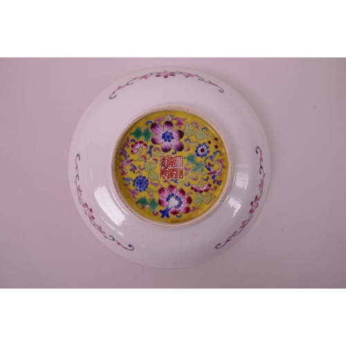 35 - A Chinese polychrome enamelled porcelain decorative saucer dish decorated with dragons and auspiciou... 