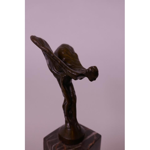 41 - A bronze figurine modelled on the Rolls Royce Spirit of Ecstasy, mounted on a marble plinth, 10½