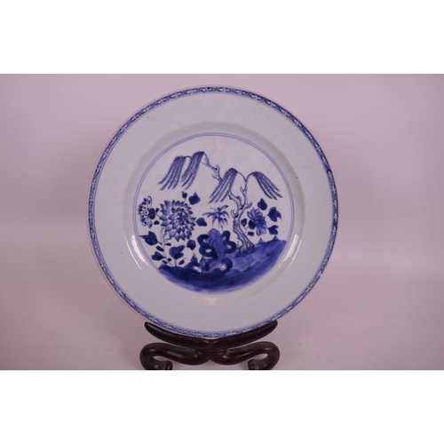 42 - A C19th Chinese blue and white tin glazed cabinet plate decorated with a willow tree and flowers, wi... 