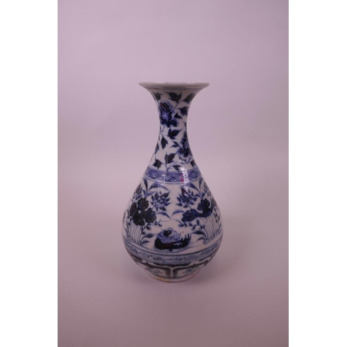 48 - A Chinese Ming style blue and white pottery pear shaped vase decorated with waterfowl in a lotus pon... 