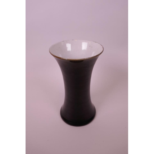 58 - A Chinese black glazed porcelain vase of waisted form, 7